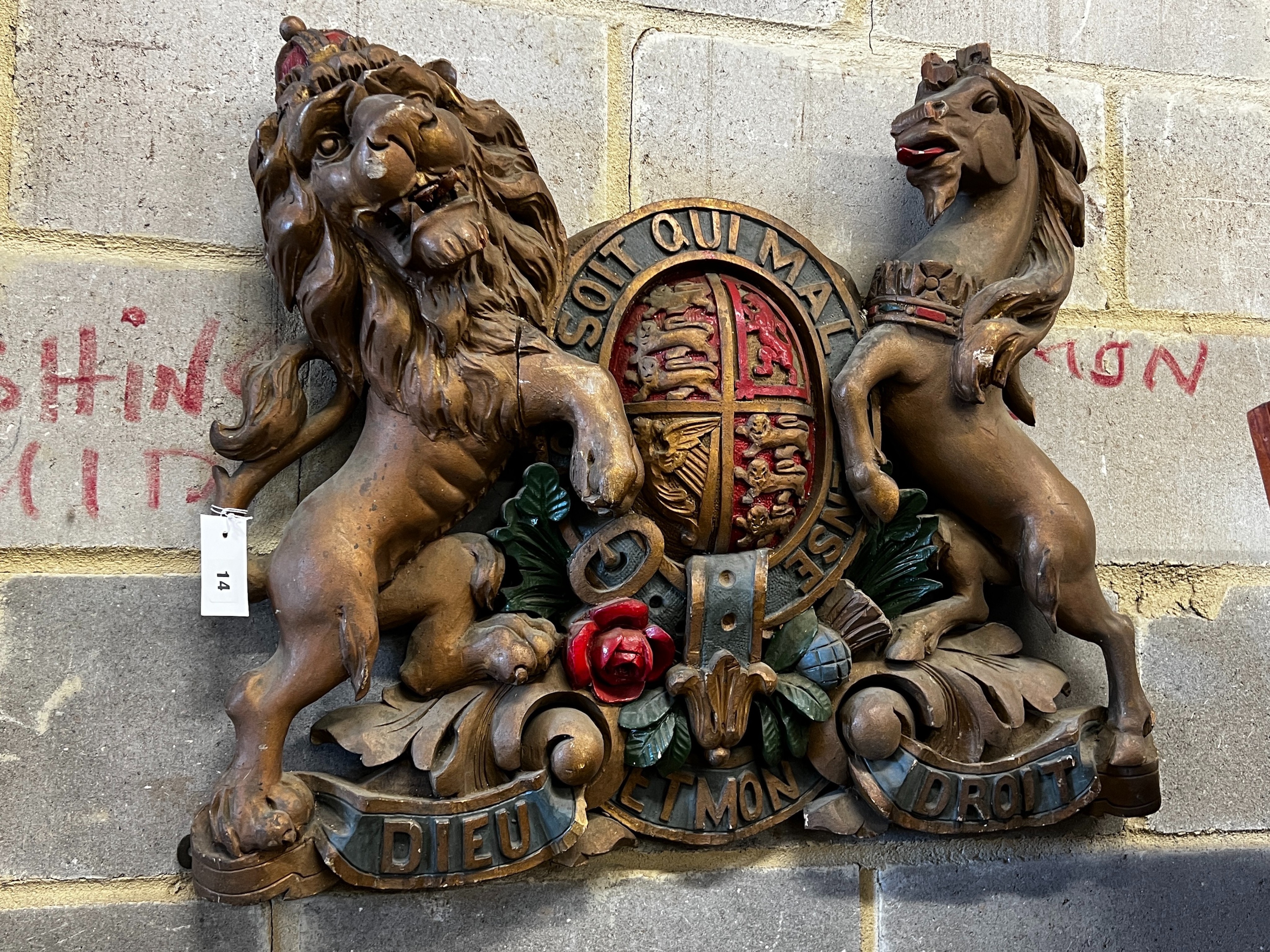 A painted carved wood Royal Coat of Arms, width 76cm, height 62cm
